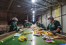 Plastic Neutrality Program - Workers sorting plastic waste